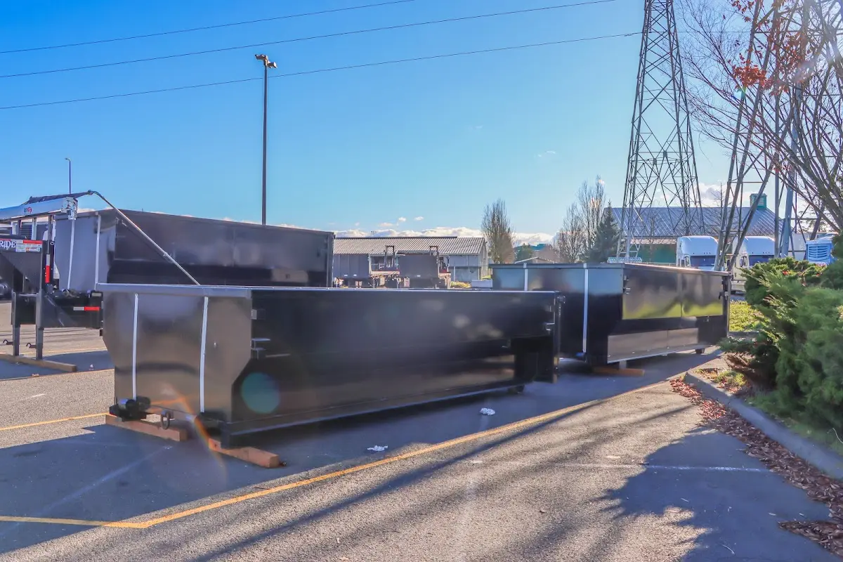 Roll-off dumpster ready for waste disposal at job site for Roofing Dumpster Rental in Mocksville